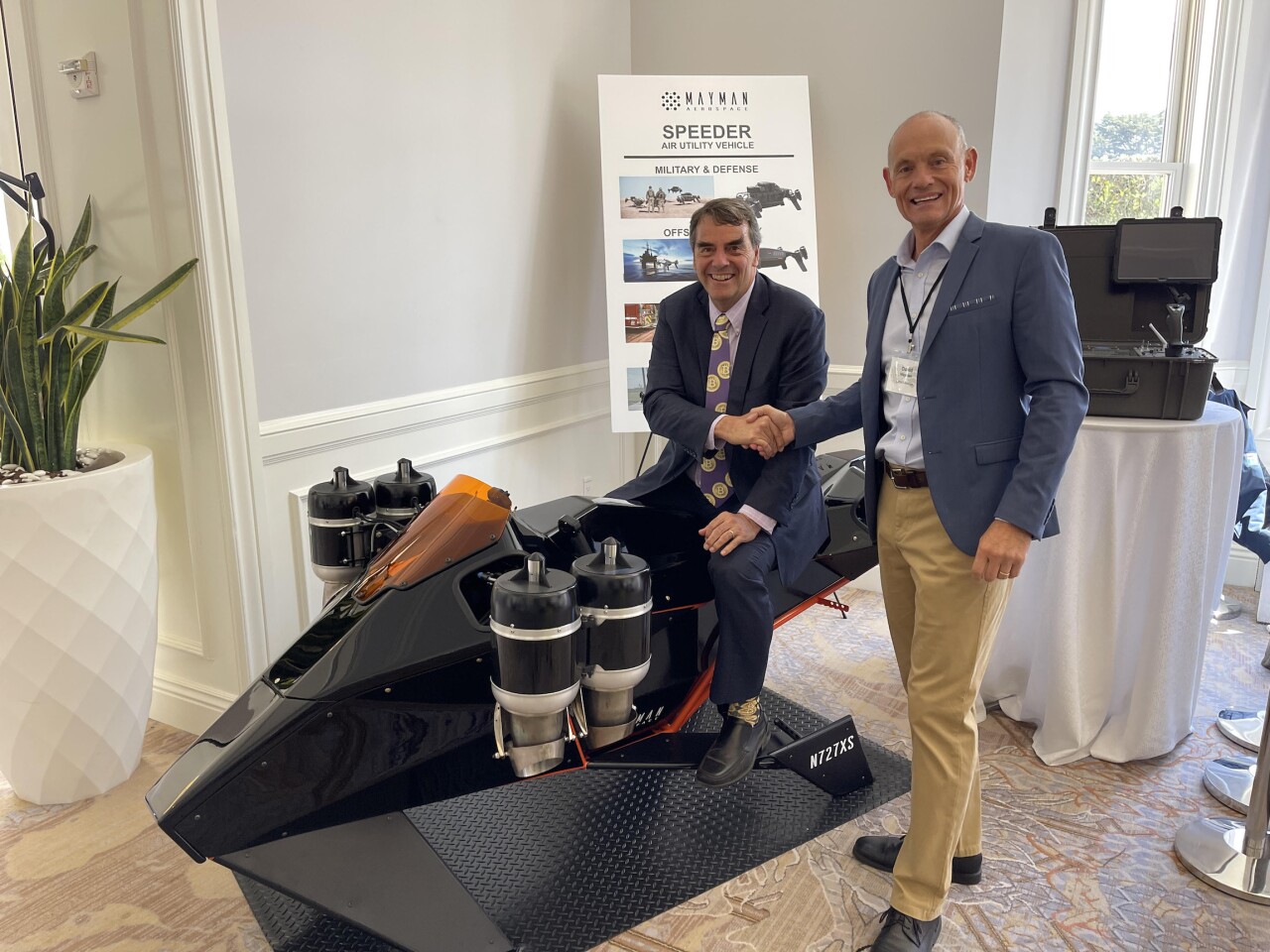 Tim Draper (seated) and Mayman Aerospace CEO David Mayman at the debut of the Speeder prototype