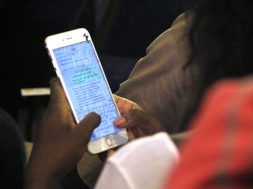 A mobile phone user seen chatting at a tech event