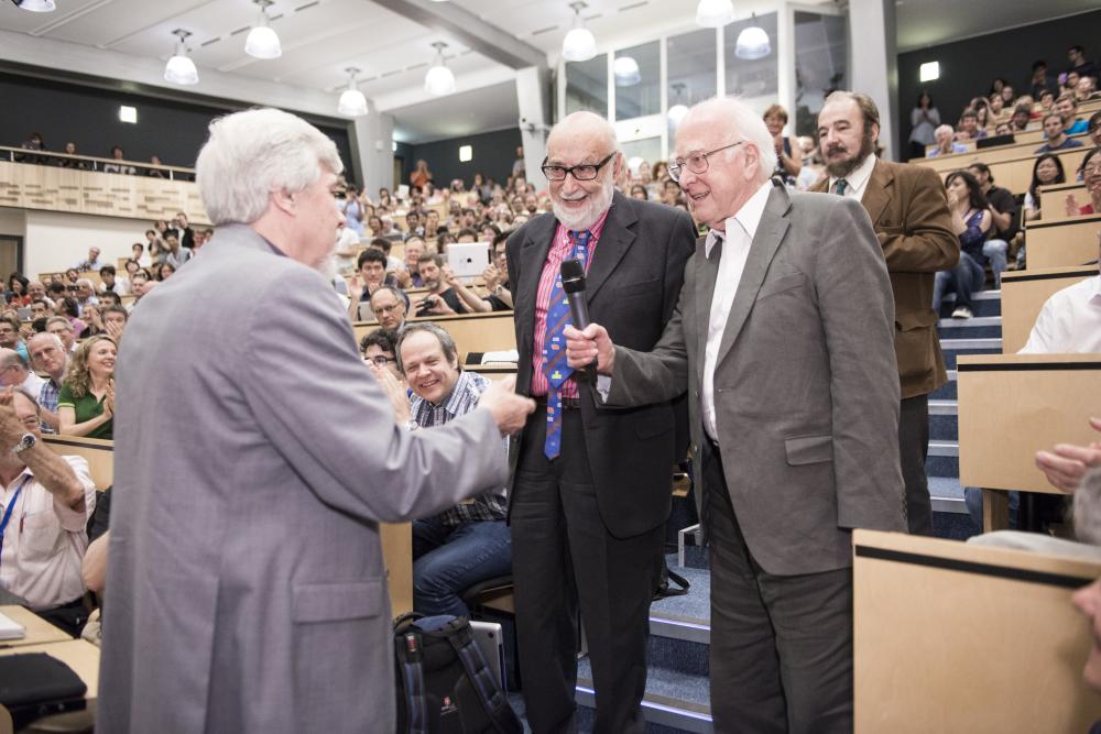 CERN Director General Rolf Heuer (left) congratulates François Englert and Peter Higgs at the announcement of the discovery of the Higgs boson on July 4, 2012