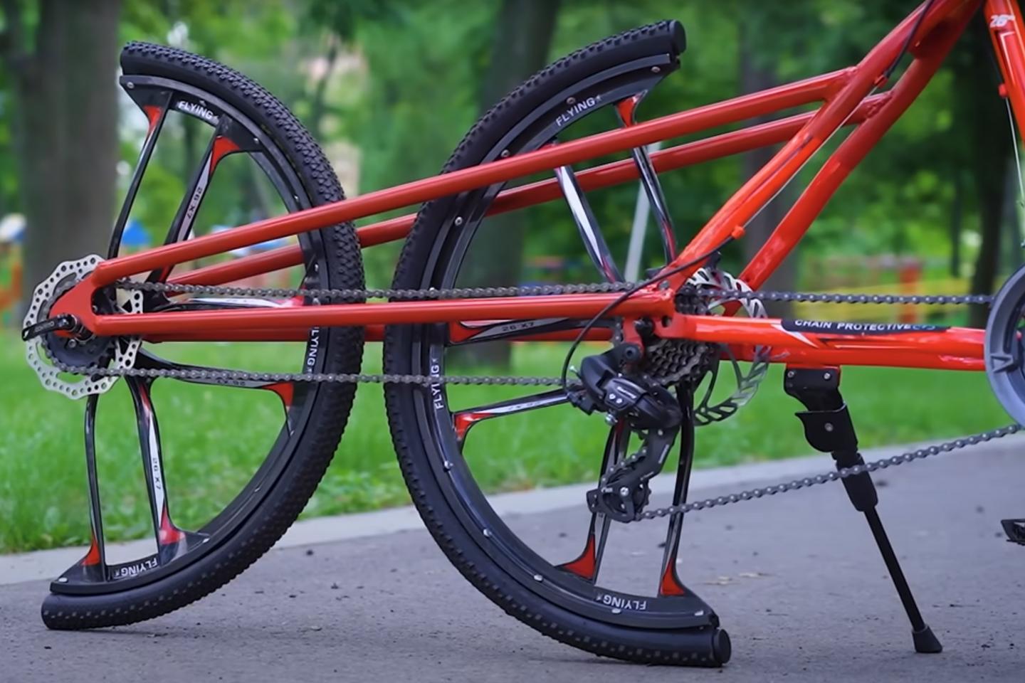 A Ukrainian YouTuber has built a bizarre but rideable bicycle with its rear wheel cut into two sections