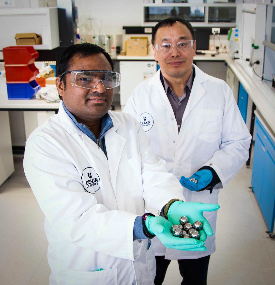 Lead researcher Dr Srikanth Mateti (left) and Professor Ian Chen with the steel balls used in the milling process