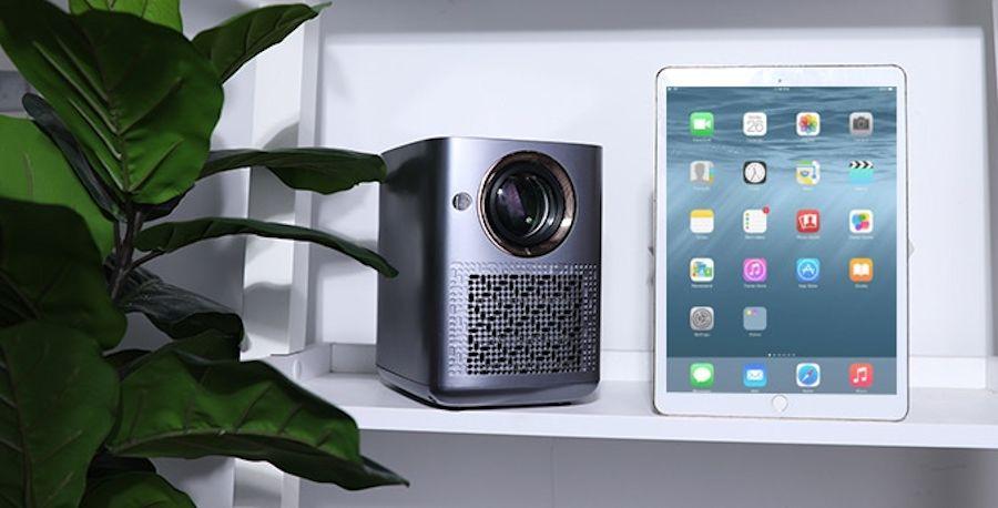 The Wejoy projector measures 7.2 x 5.3 x 7.4 inches, and users can interact with visuals thrown on a wall or screen via a battery powered pen