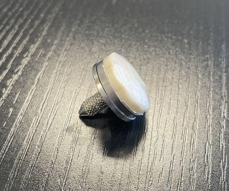 A sample of the new cartilage-replacing hydrogel, attached to its titanium base for an implantable device