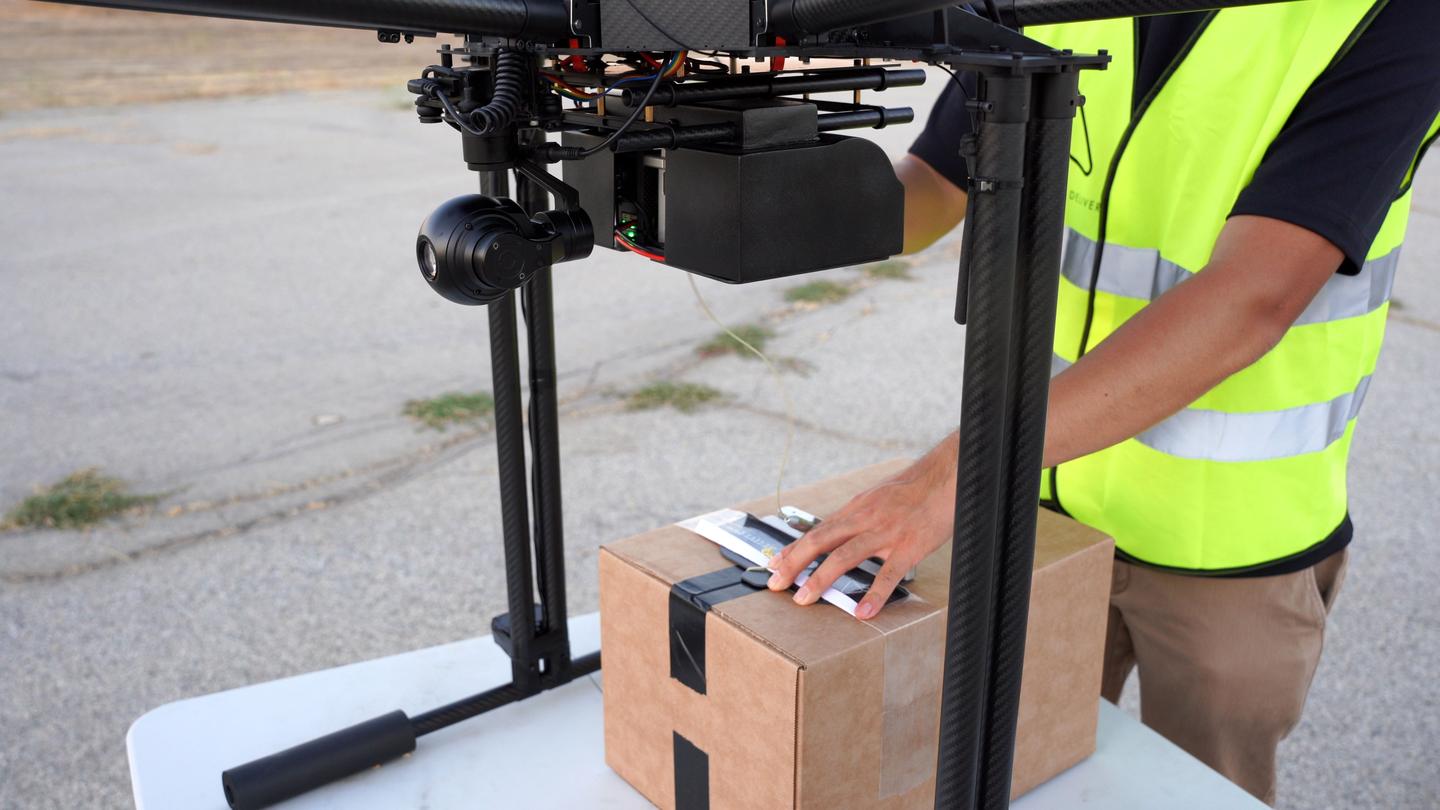 A box is hooked up to RDS2 using a strapping tape handle