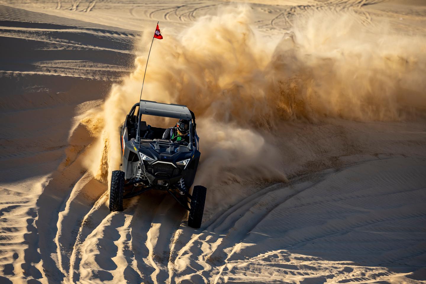 The powerful little Polaris RZR TurboR allows for a lot of fun maneuvering in the deep sands near Glamis, California