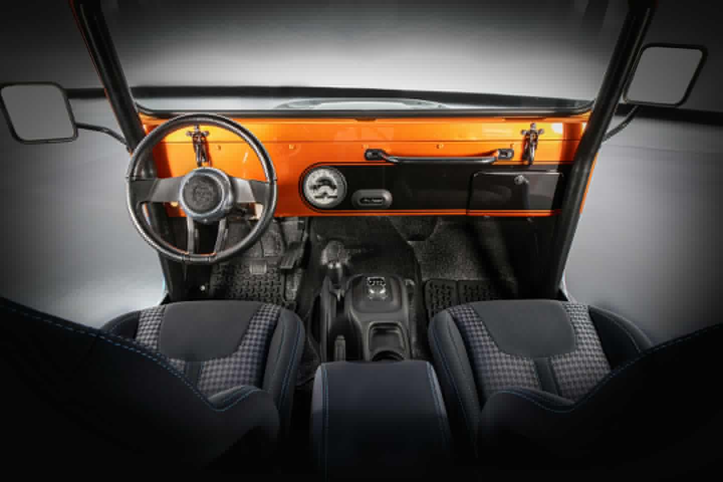 The classic minimalist interior gets upgraded with an EV-ready gauge, Copper Canyon paint, new seats and a few other upgrades