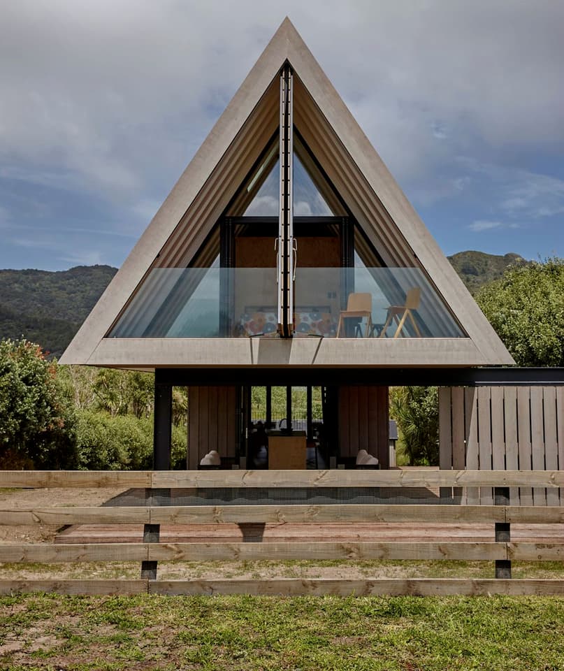 The home features the use of natural timber and a dramatic pitched roof