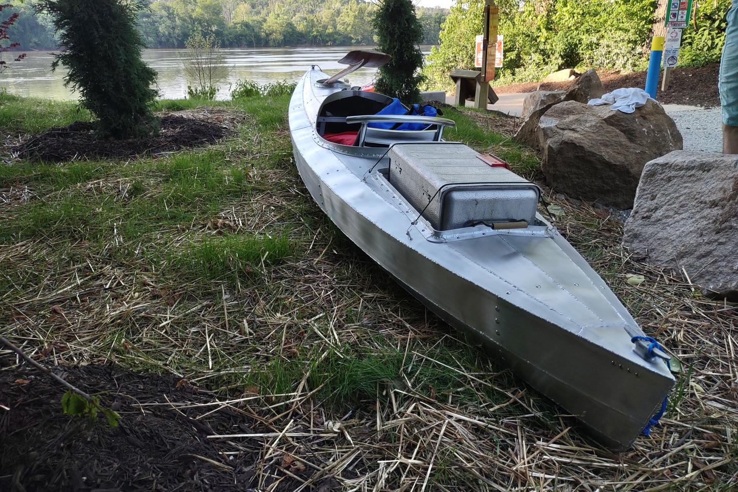 The scavenged secondhand cooler's aluminum exterior nicely matches the kayak