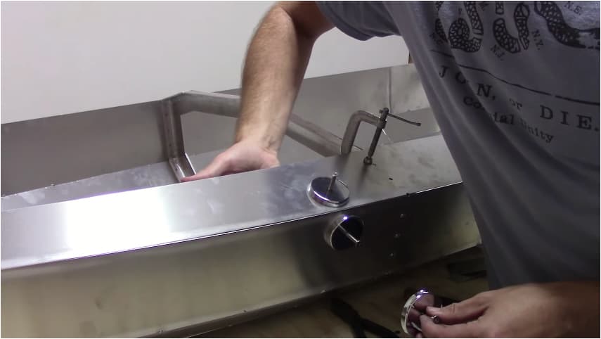 Kunka used a door hinge and magnets to keep some of the aluminum panels aligned for welding