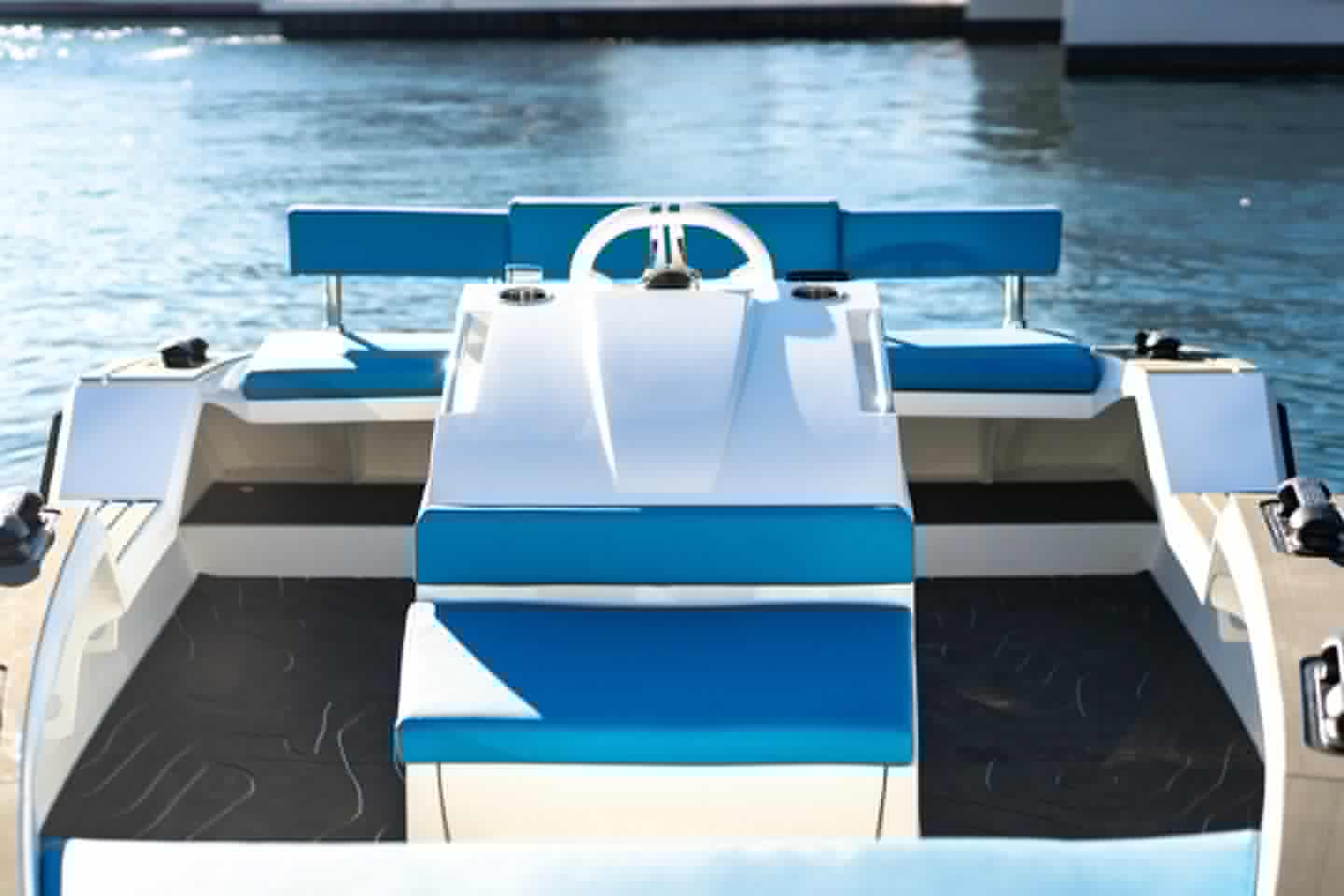 We only count five total seats, so it looks like the last one aboard is standing or maybe sitting on the bow