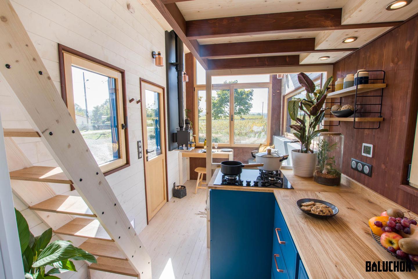 The Yggdrasil's kitchen includes a glazed partition wall to offer some sense of separation while still ensuring light permeates within