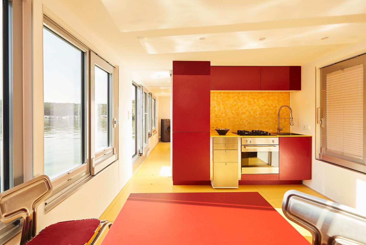 The Fàng Sōng's kitchen area includes a sink, fridge, oven, and four-burner propane-powered stove