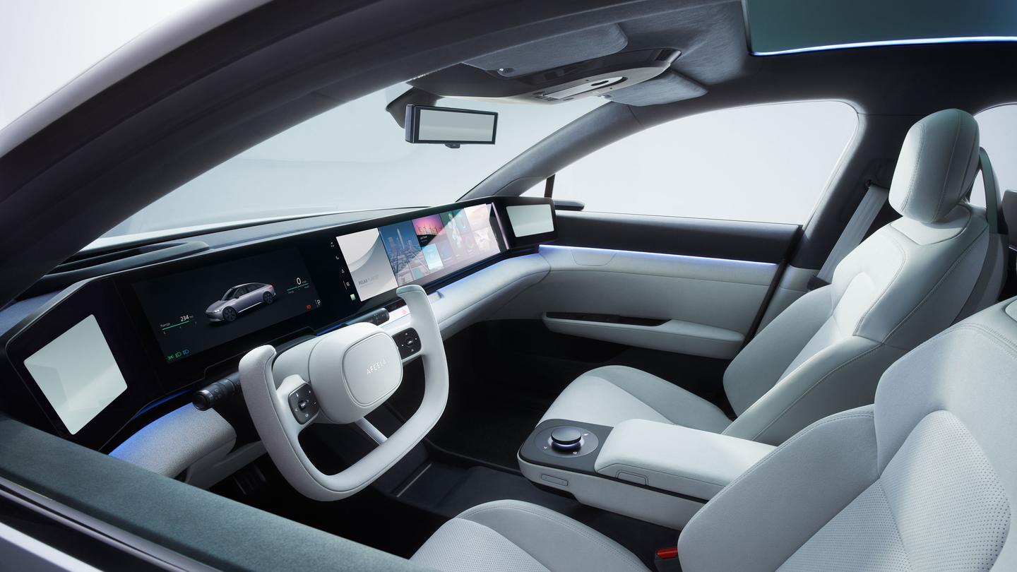 Like the original Vision-S concept, the Afeela prototype has a full-width digital dashboard capped by side-view camera screens
