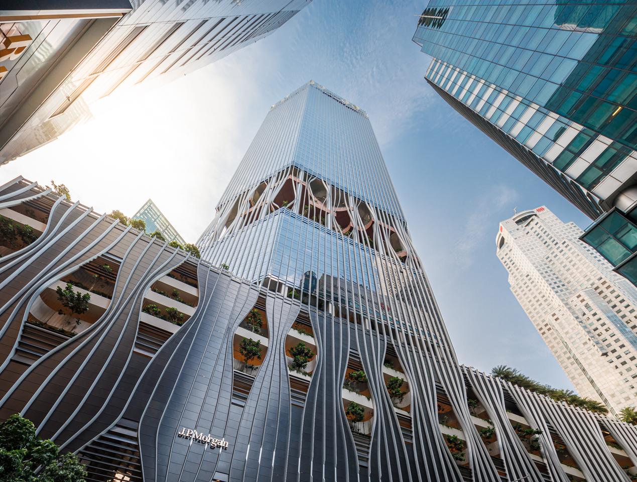CapitaSpring's aluminum facade includes several eye-catching openings, revealing the greenery inside