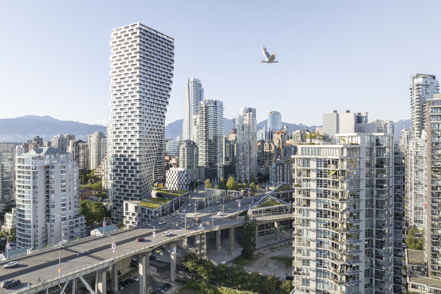 Vancouver House's unusual top-heavy form came about because local planning regulations state that the tower must be no less than 30 m (98 ft) from the nearby bridge until it reaches a height of 30 m (98 ft)