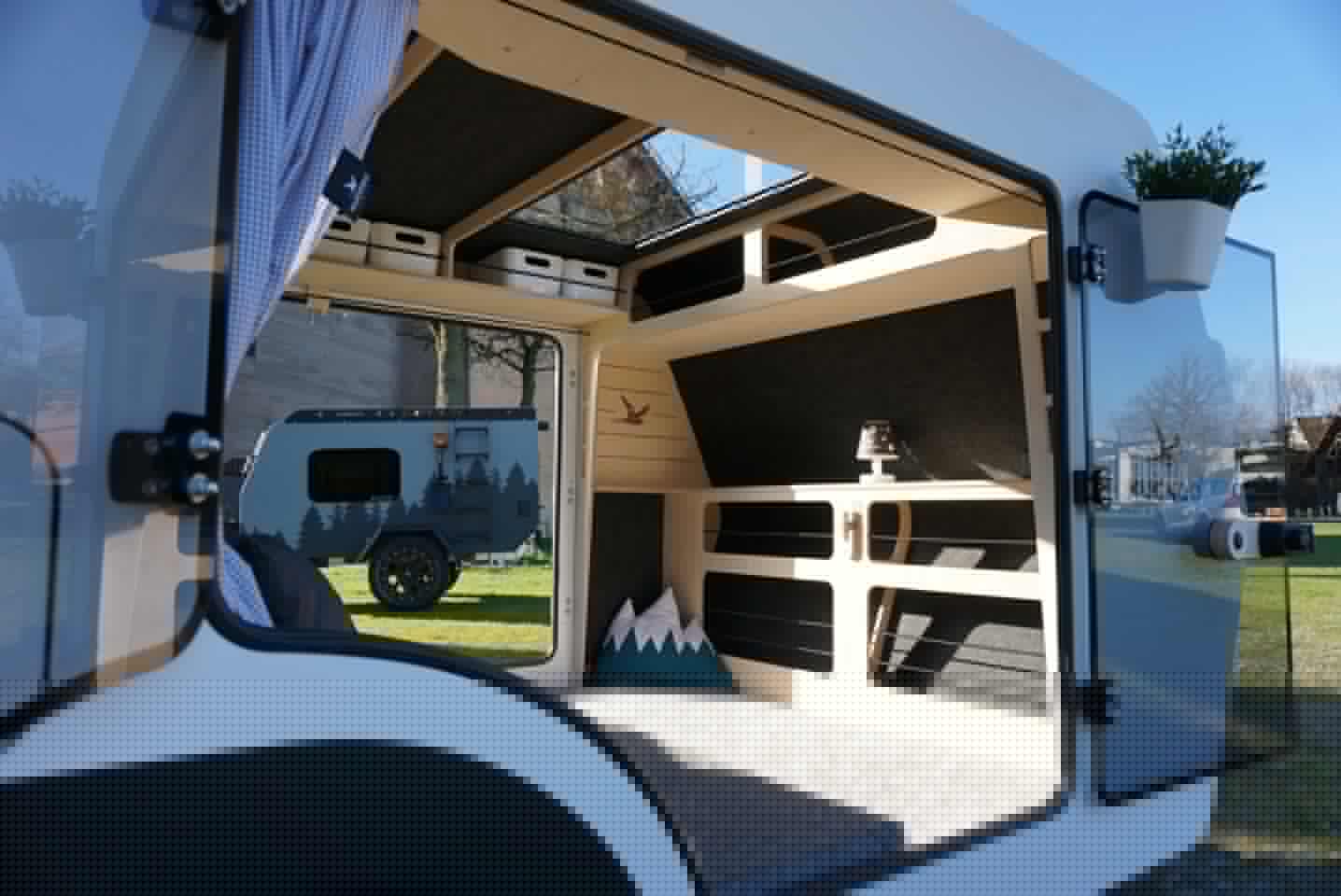 With the optional second glass door entry, the Emma trailer becomes a breezy base camp with views in nearly every direction