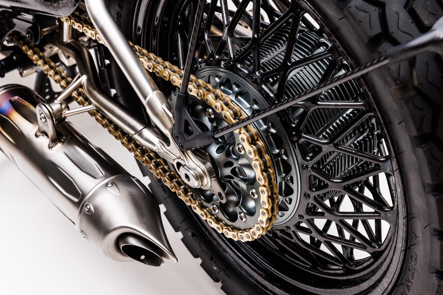 Ye gods, look at those handmade carbon rims and the titanium exhaust