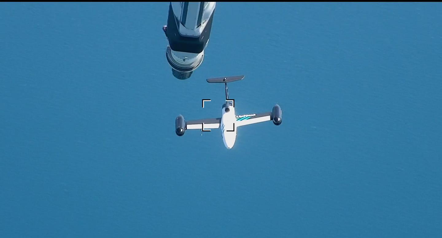 The drone was guided close to the tanker to simulate a refueling maneuver