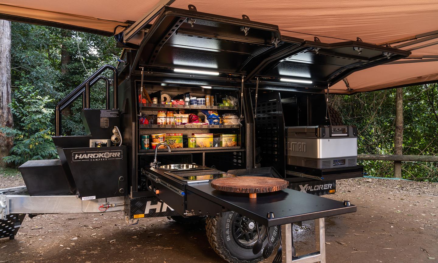 The lefthand side of the trailer is designed to accommodate the available slide-out kitchen, pantry and fridge/freezer