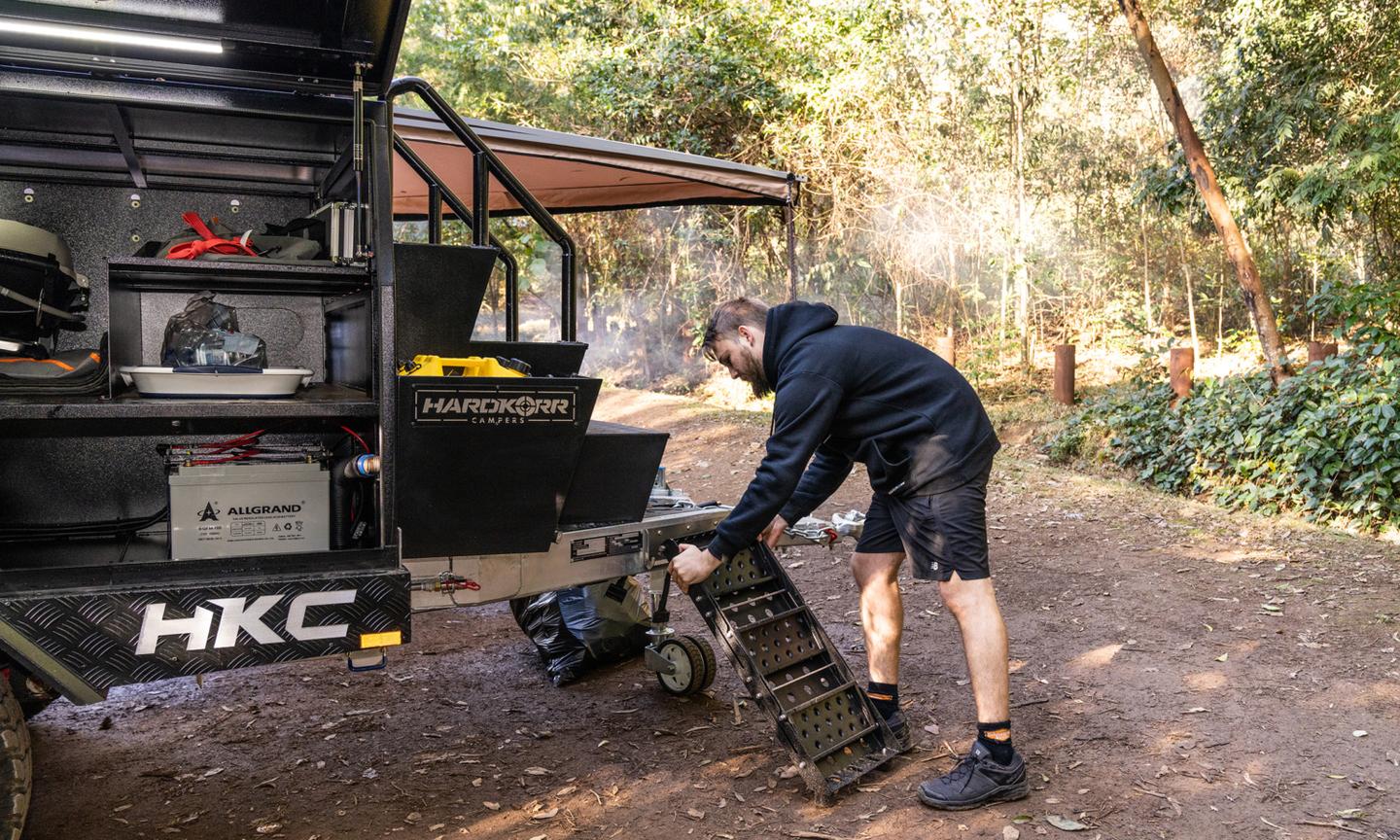The removable folding staircase attaches to the front to complete the climb up to the tent