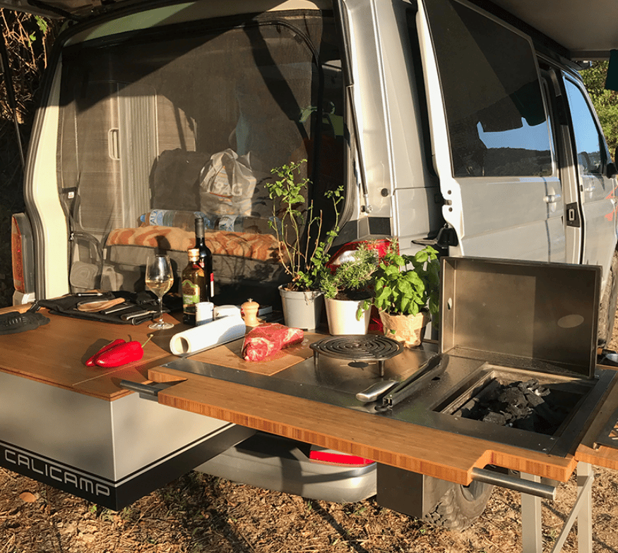 This Calicamp features charcoal BBQ, gas burner and cutting board inserts