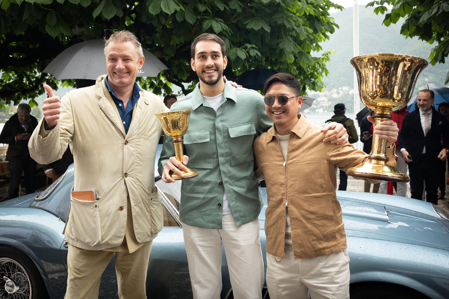 Picking up the Coppa d’Oro Villa d’Este for "best in show" as voted by the public are Jonathan Hui and friend, with the event compere Simon Kidston joining the photo. Kidston's life has been steeped in automobiles, from his "Bentley Boy" uncle who won Le Mans driving with Bentley owner Woolf Barnato, through to his exploits in auctioning, selling and brokering the sale or purchase of many of the world's most important automobiles, including the USD$146.6 million (EUR€135 million) Mercedes-Benz 300 SLR Uhlenhaut Coupé. Kidston operates a collectible car consultancy named Kidston, runs the K500 collectible car market guide, publishes automotive books, produces automotive films, writes for some of the world's leading publications and comperes Concorso d’Eleganza Villa d’Este with charm and fluency in three languages.