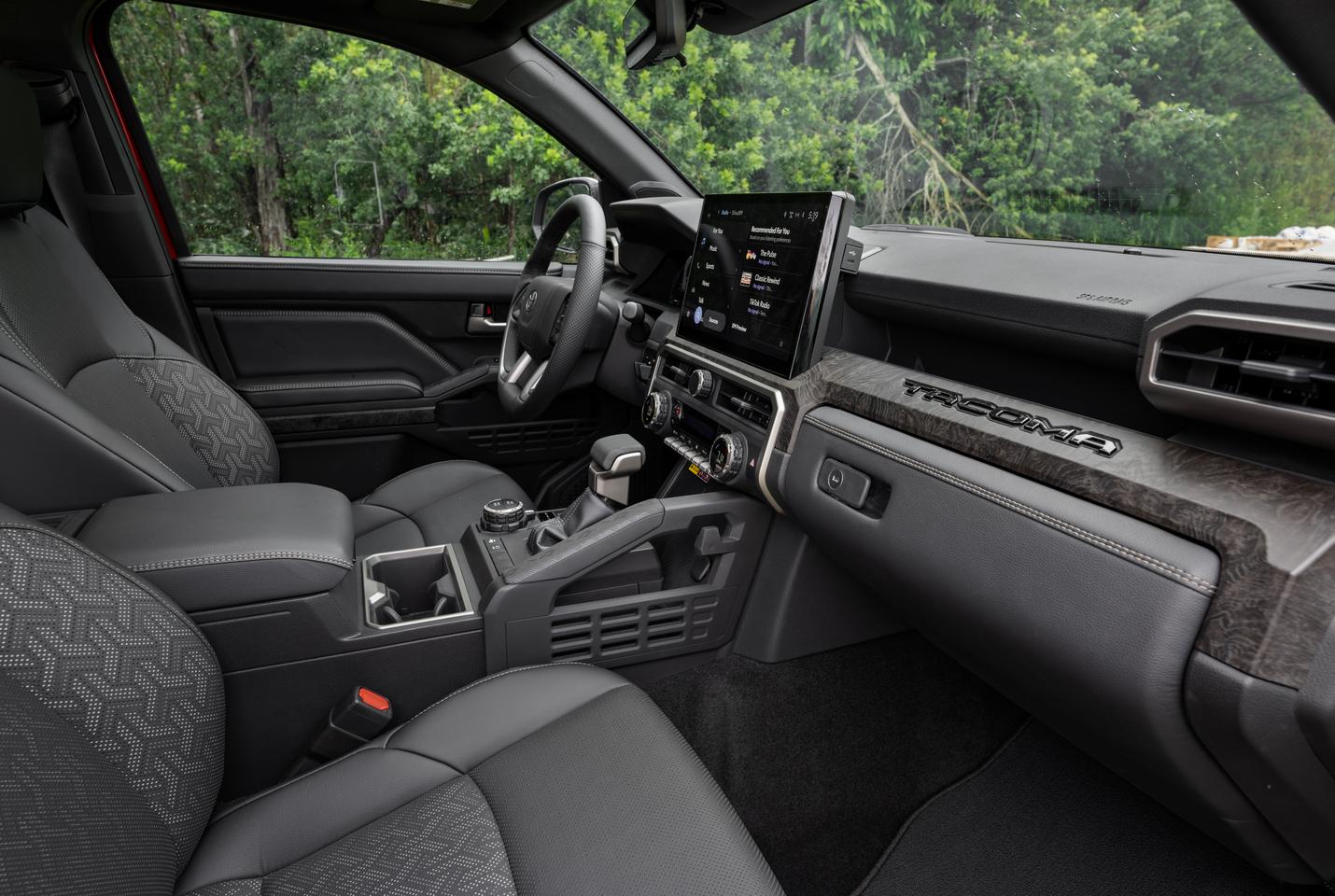 Small features such as an integrated bag hook on the newly-located grab bar are found throughout the Tacoma