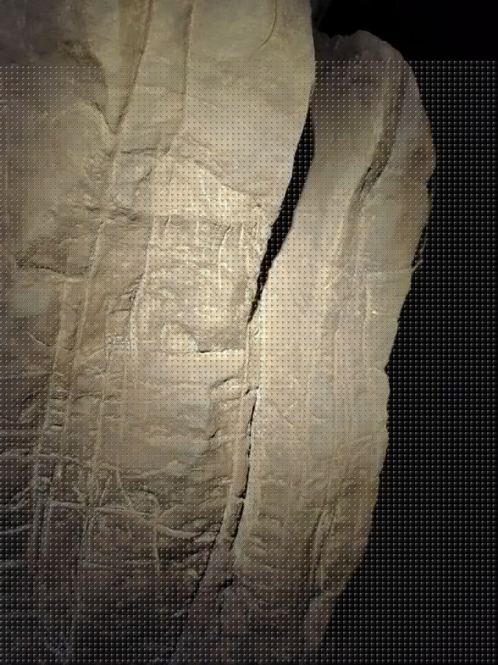 Etchings found in the cave wall near the burial site show geometric shapes that suggest meaning