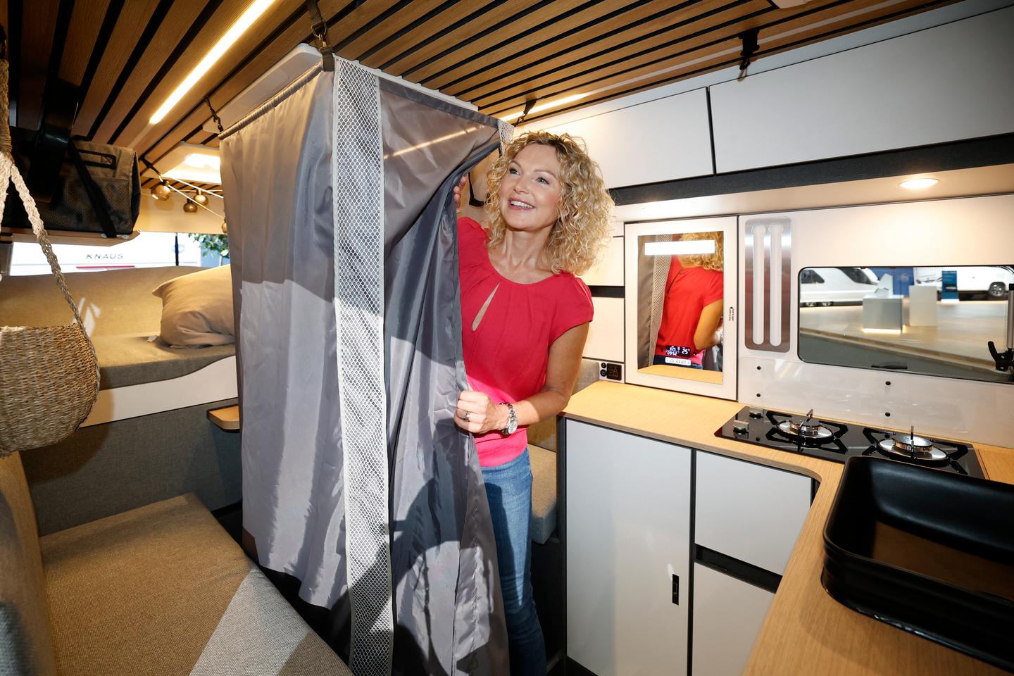 The "Secret Shower" stores away in a compartment below the slide-out dining table, quickly deploying for a morning or evening scrub