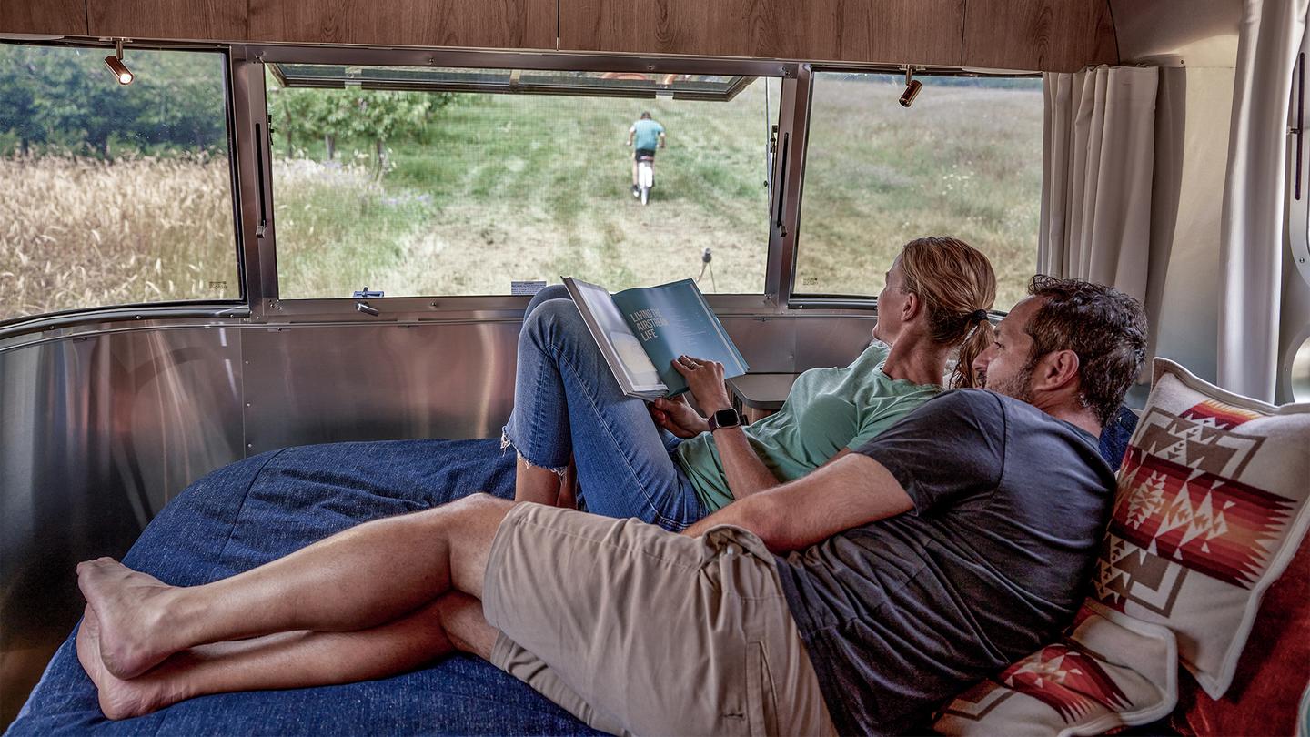 Airstream says the master bed hugs the contour of the trailer for a cozier lie