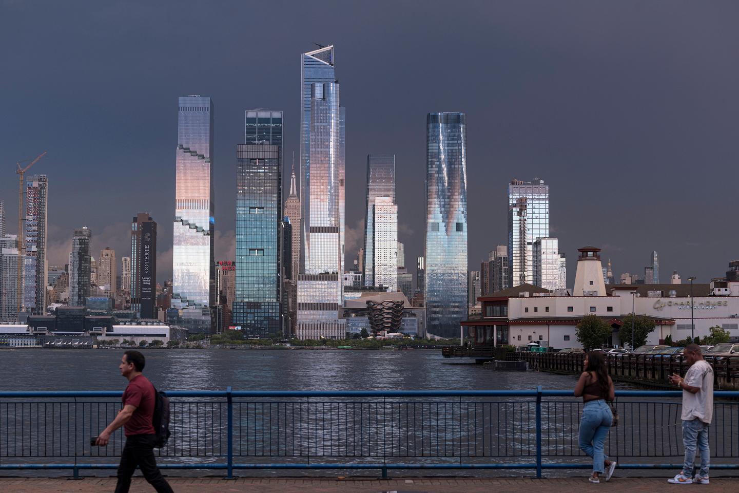 The Spiral is part of the Hudson Yards mega-development which also includes Heatherwick Studio's Vessel and KPF's 30 Hudson Yards, both of which are visible above