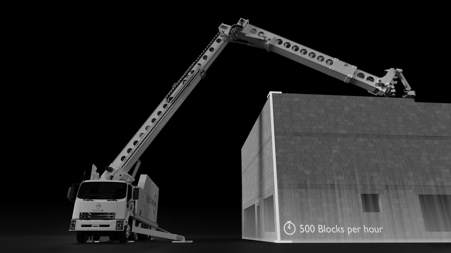 The 32-metre telescoping boom arm can build 3-storey structures from street level