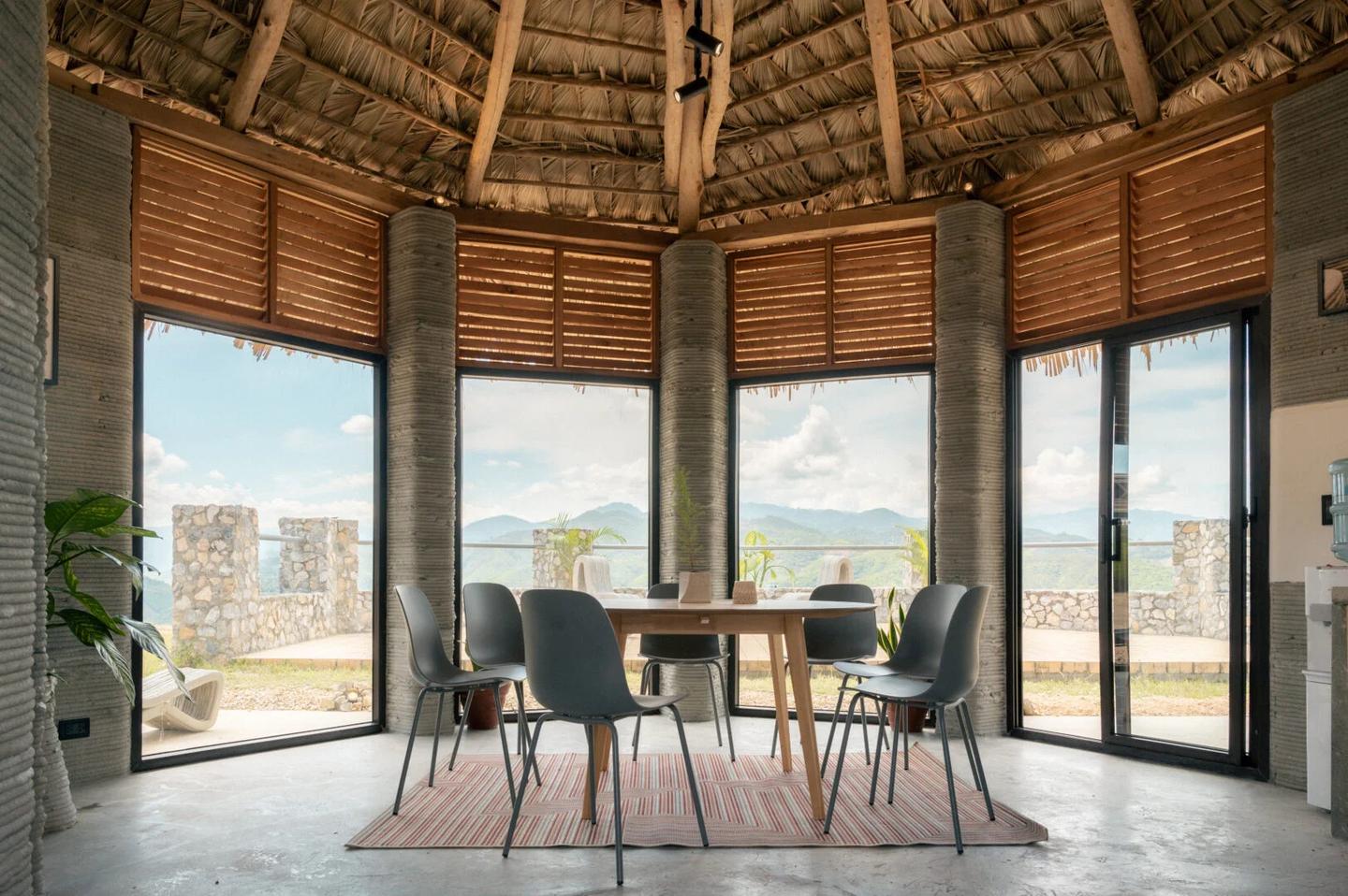The 3D-printed house has a simple and utilitarian decor that leaves the concrete shell on display