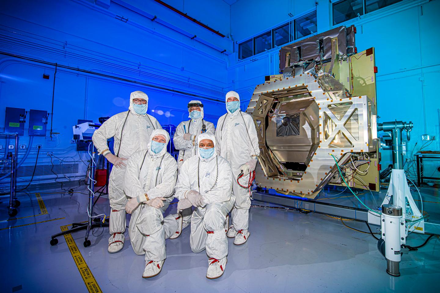 NASA’s Goddard team members along with the Ball Aerospace integration and test team pose after the sRCS is integrated into Roman's WFI