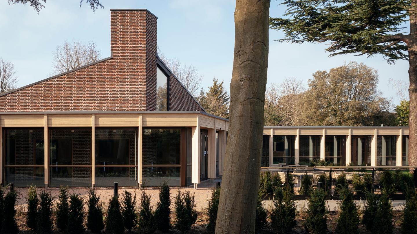 The John Morden Centre consists of multiple brick buildings joined by a timber walkway