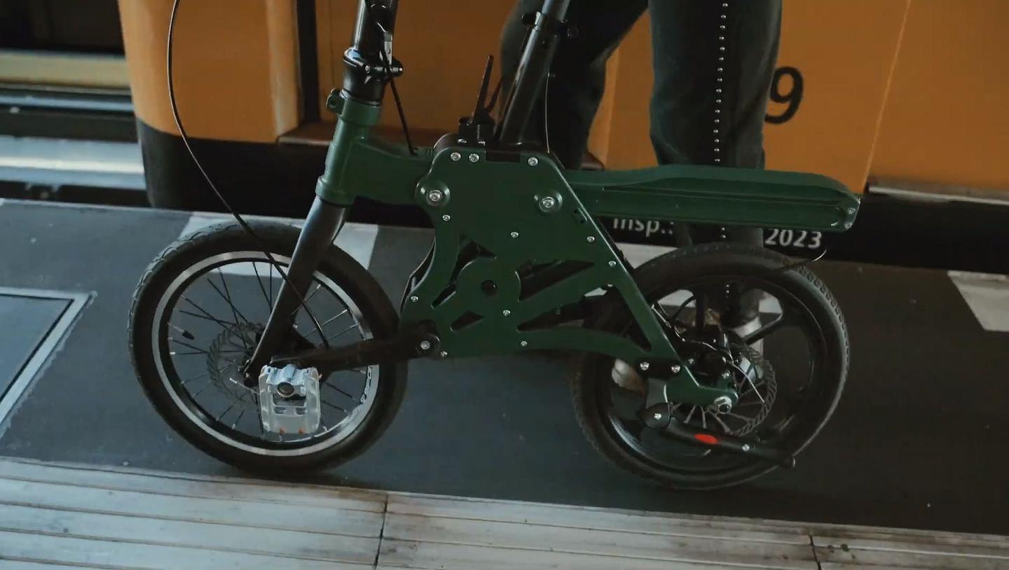 The lever up top allows the front part of the frame to slide back towards the rear