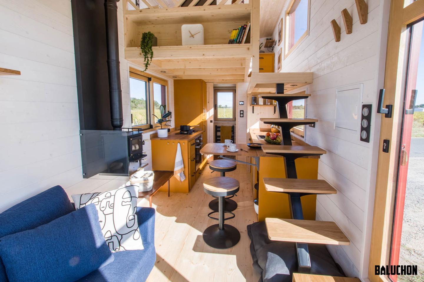 The Golden Hour's bedroom is reached by a floating staircase that's integrated into the kitchen cabinetry
