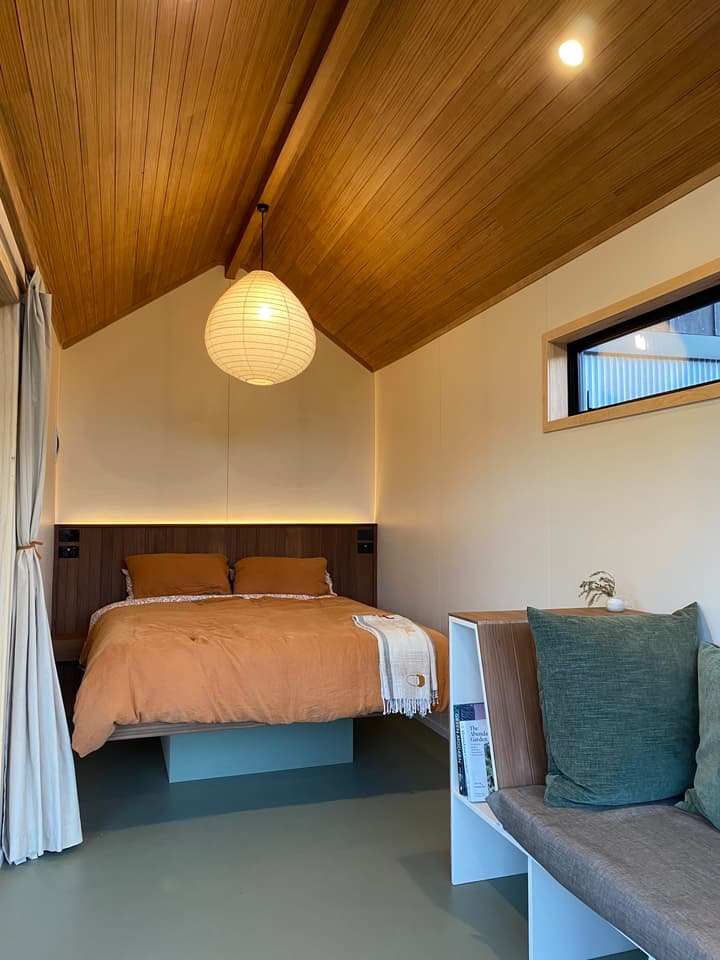 The Beach's main living area includes a sofa and a double bed, as well as some storage space
