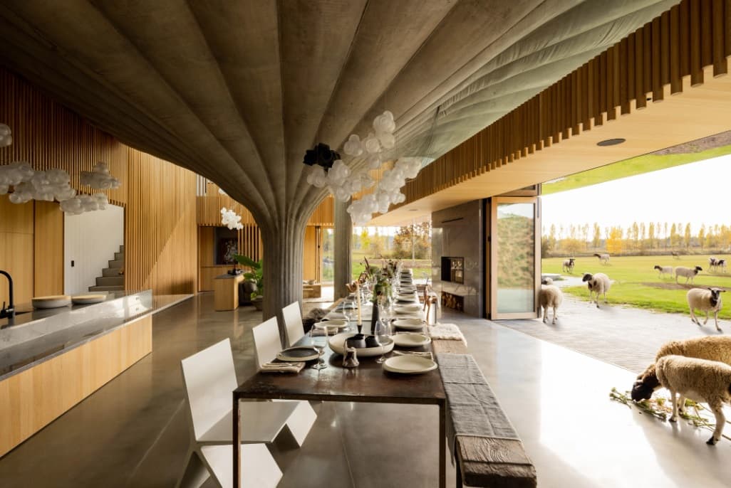 Sliding windows open the interior onto the adjoining large timber outdoor terrace