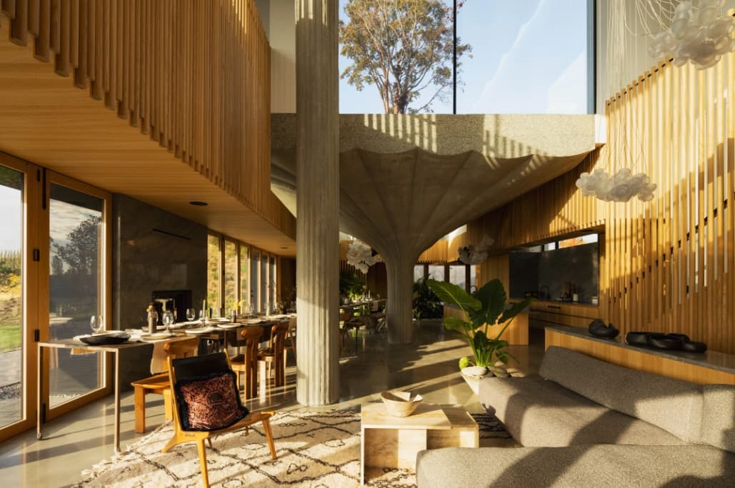 Large windows flood the interior of the home with natural light