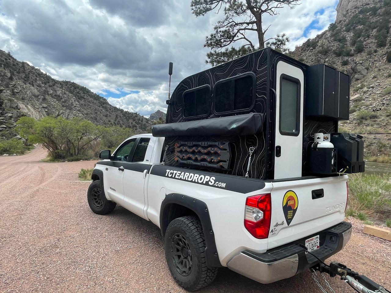 With no pop-up roof, the ultra-lightweight TC Truck Camper is ready to roll after closing the door and flipping the truck's tailgate