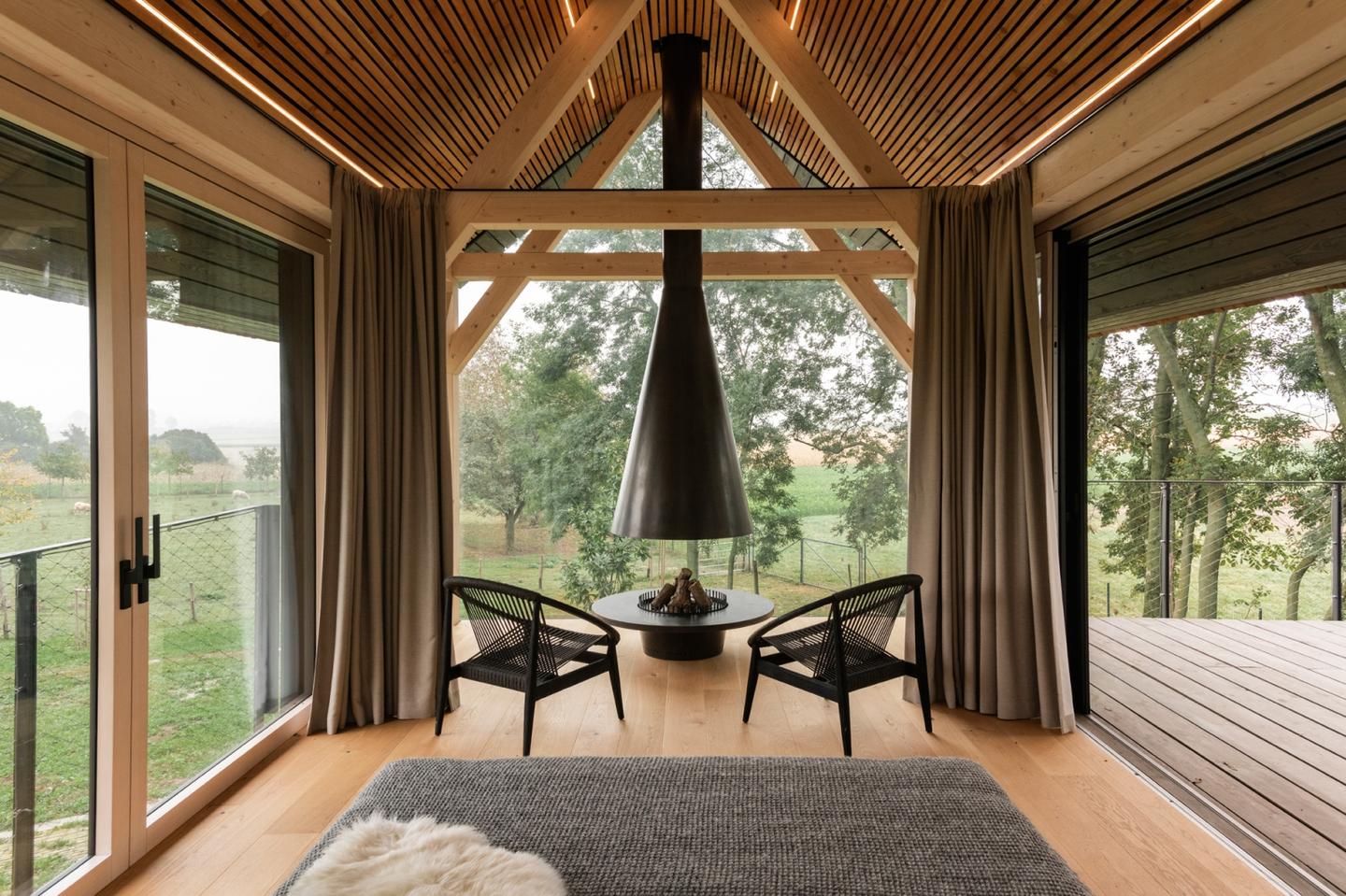 The living area boasts 360 degrees of unobstructed views of the surrounding orchard and trees