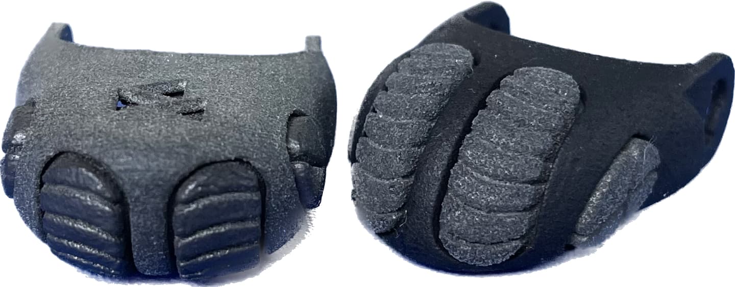 Top and bottom views of an Artus fingertip segment, with the DigiSkin visible on the underside