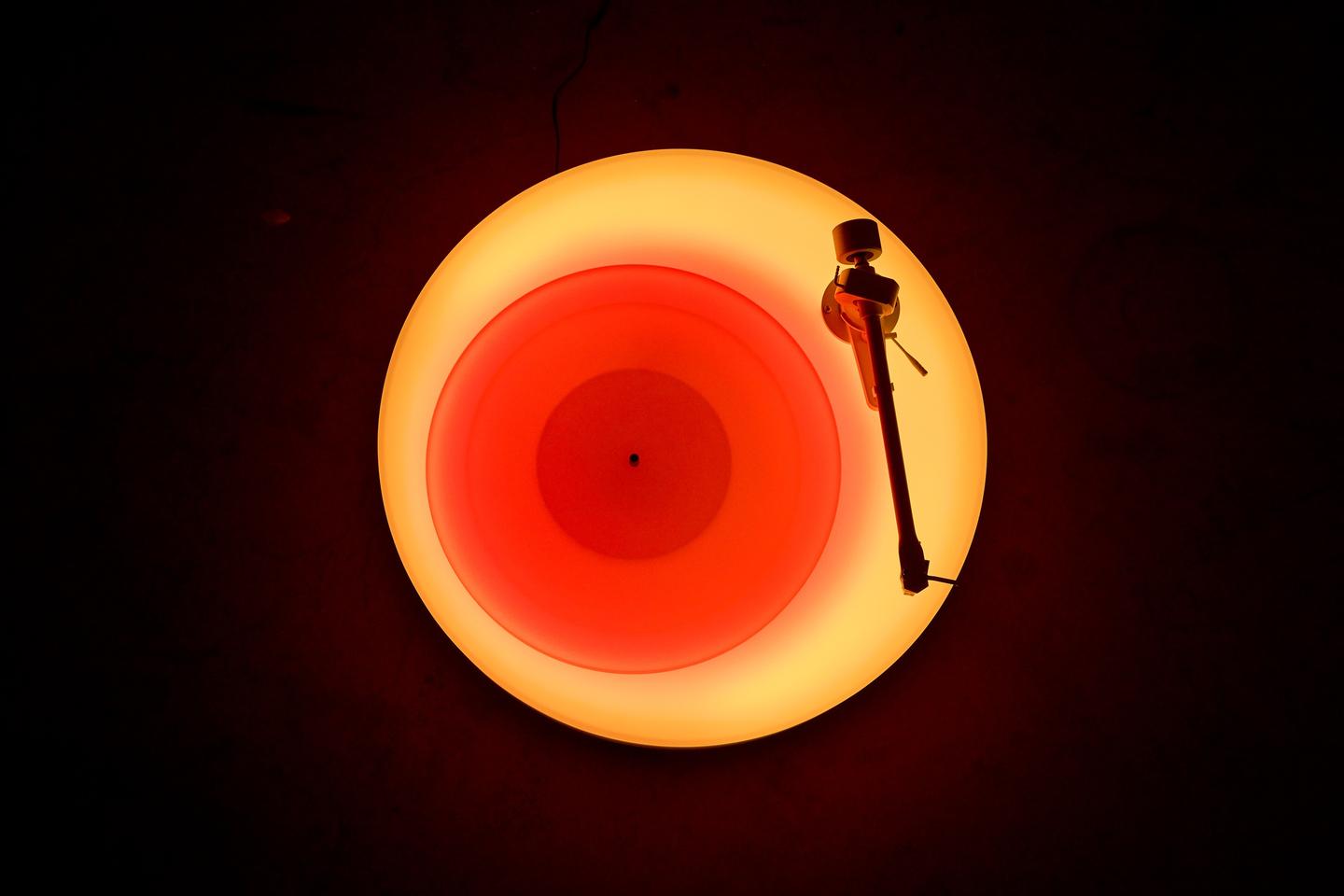 The Turntable II's base and platter are programmed to slowly change color to produce random "colorscapes"