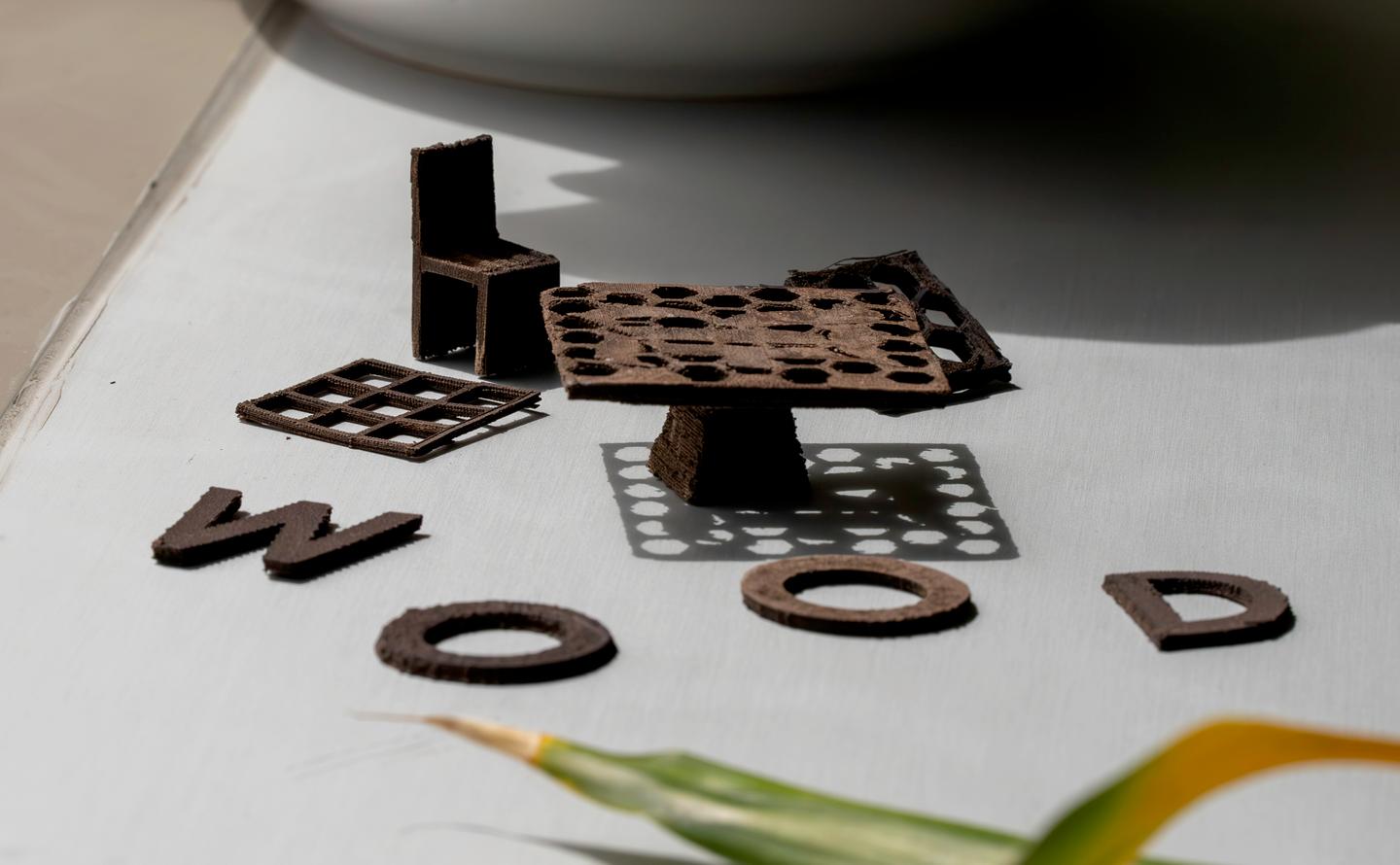 A selection of the 3D-printed wooden objects, including a little table and chair