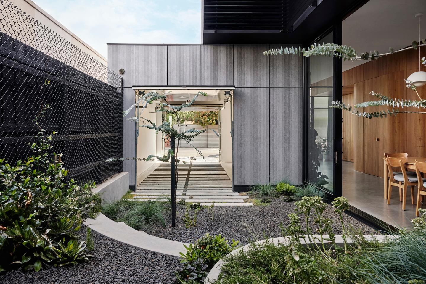 Lang is arranged around two garden areas, plus the front yard
