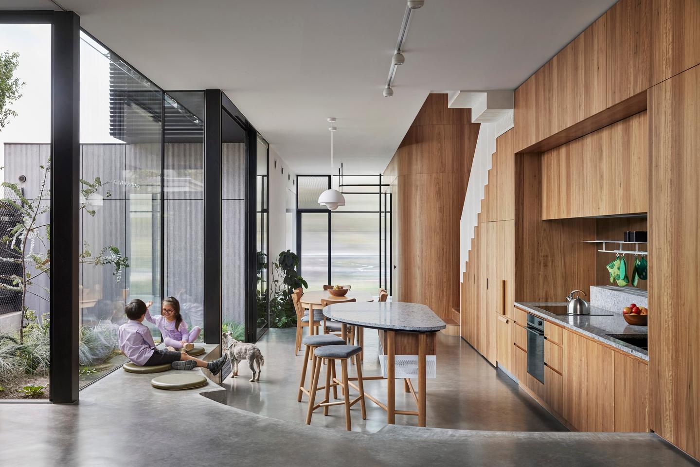 Lang's generous glazing opens up to the outside, encouraging natural ventilation throughout the interior