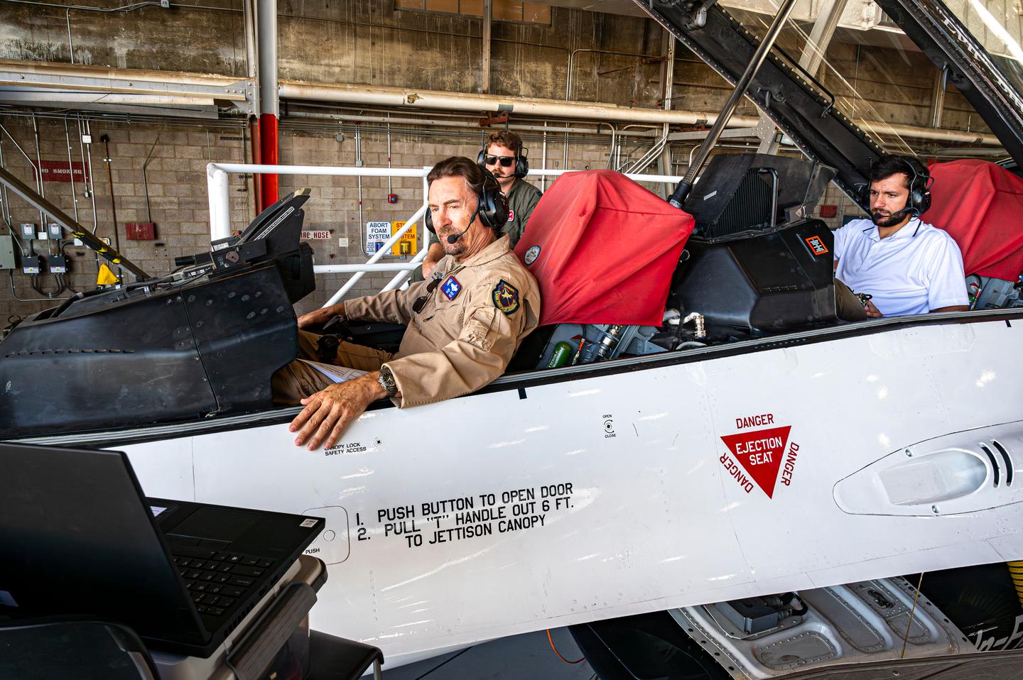 William Gray, Chief Test Pilot, USAFTPS, and other engineers conduct software updates to the X-62 VISTA
