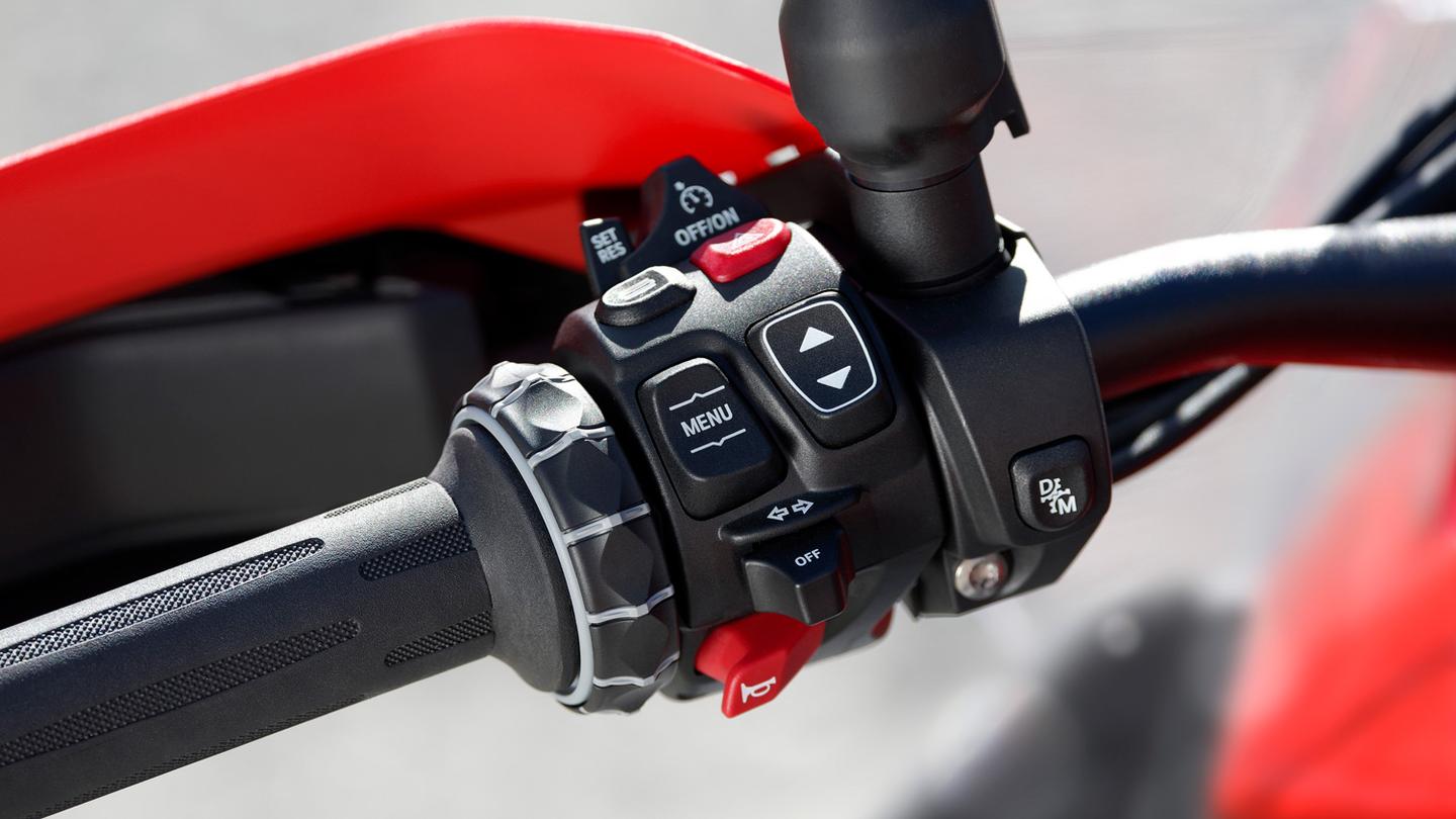 This small button now offers seamless switching from manual to automatic - two motorcycles in one!