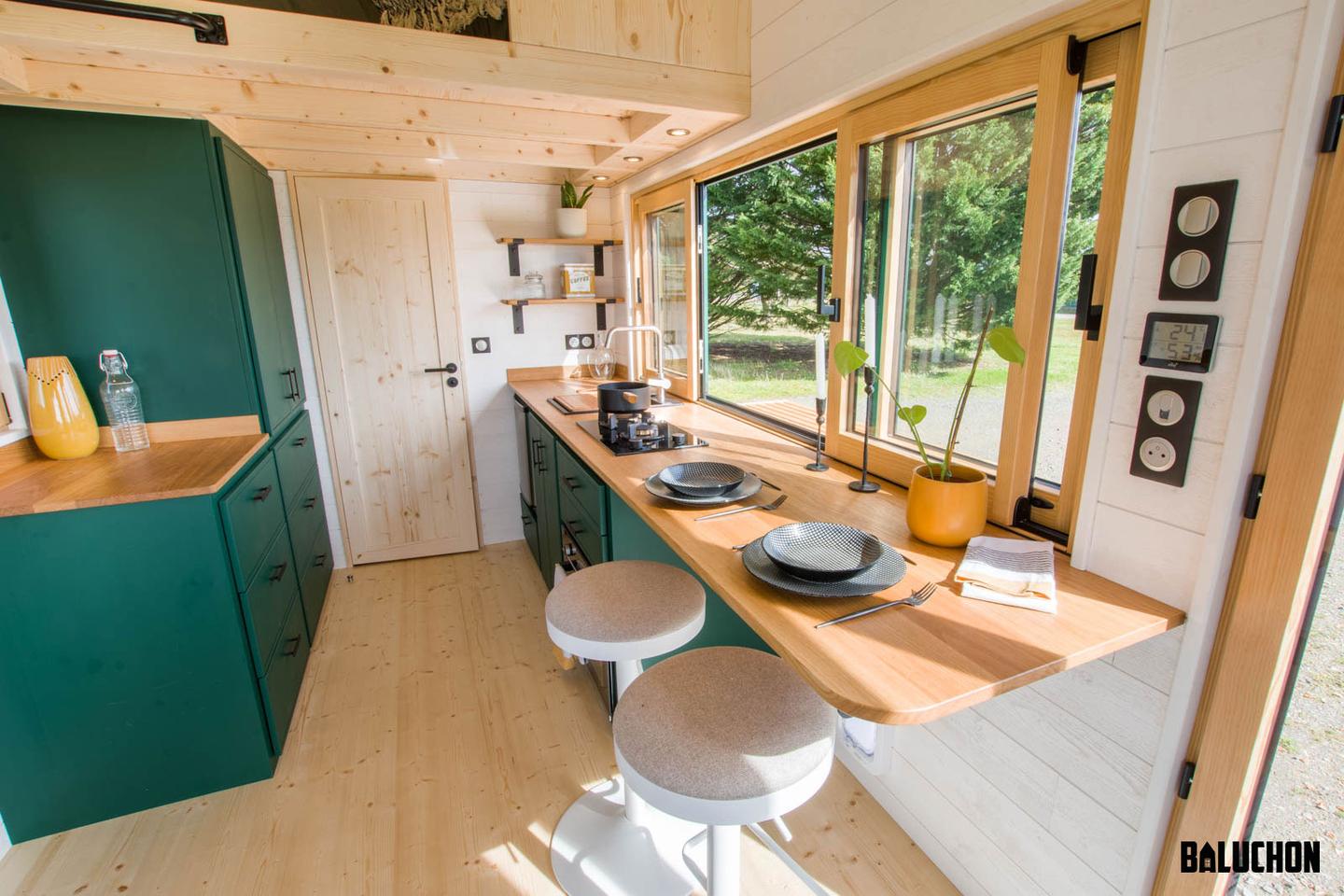 The Mirasol's kitchen includes a breakfast bar area with stool seating for two